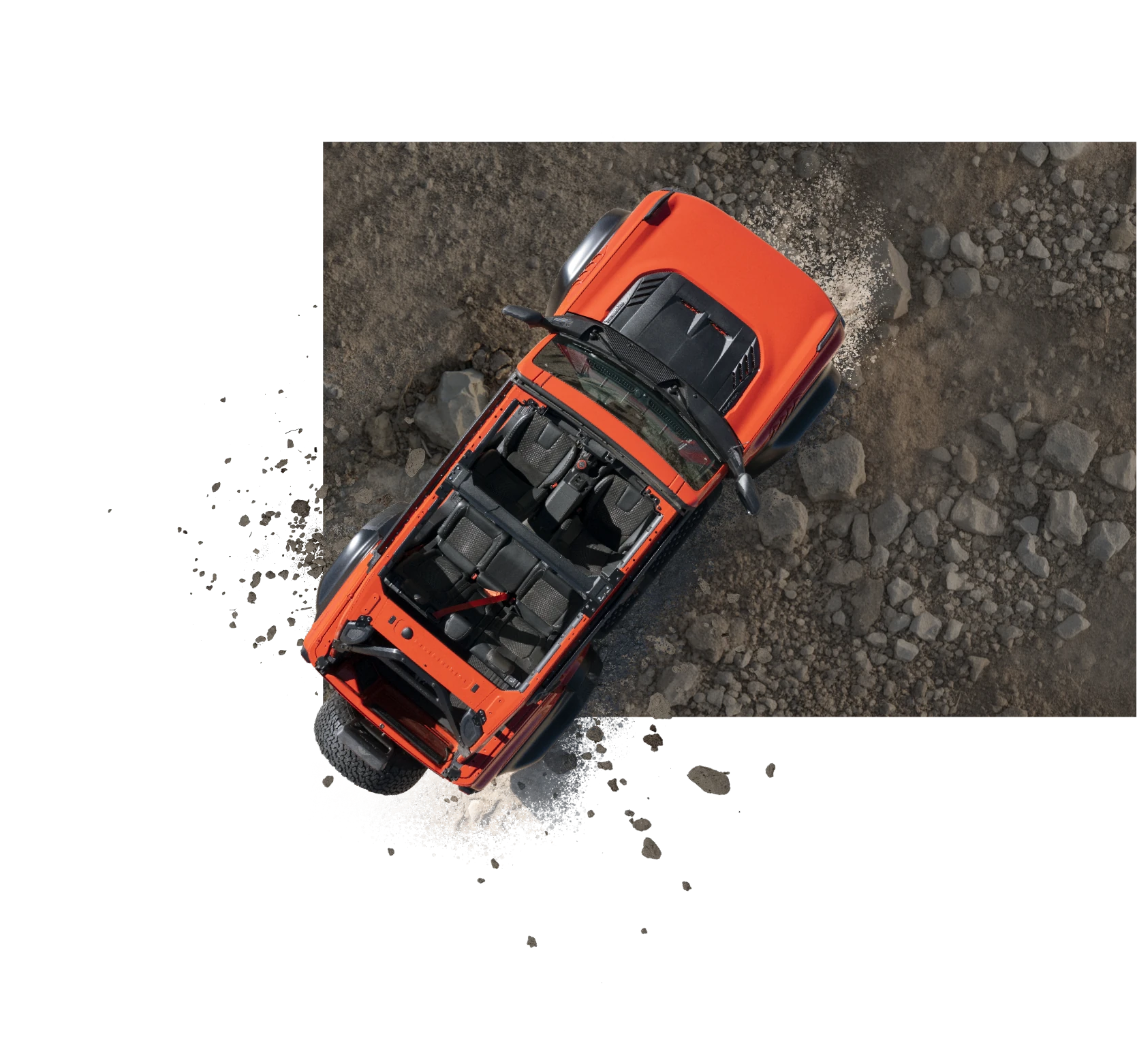 Bronco Raptor seen from directly above, kicking up dust on a rocky Nevada trail
